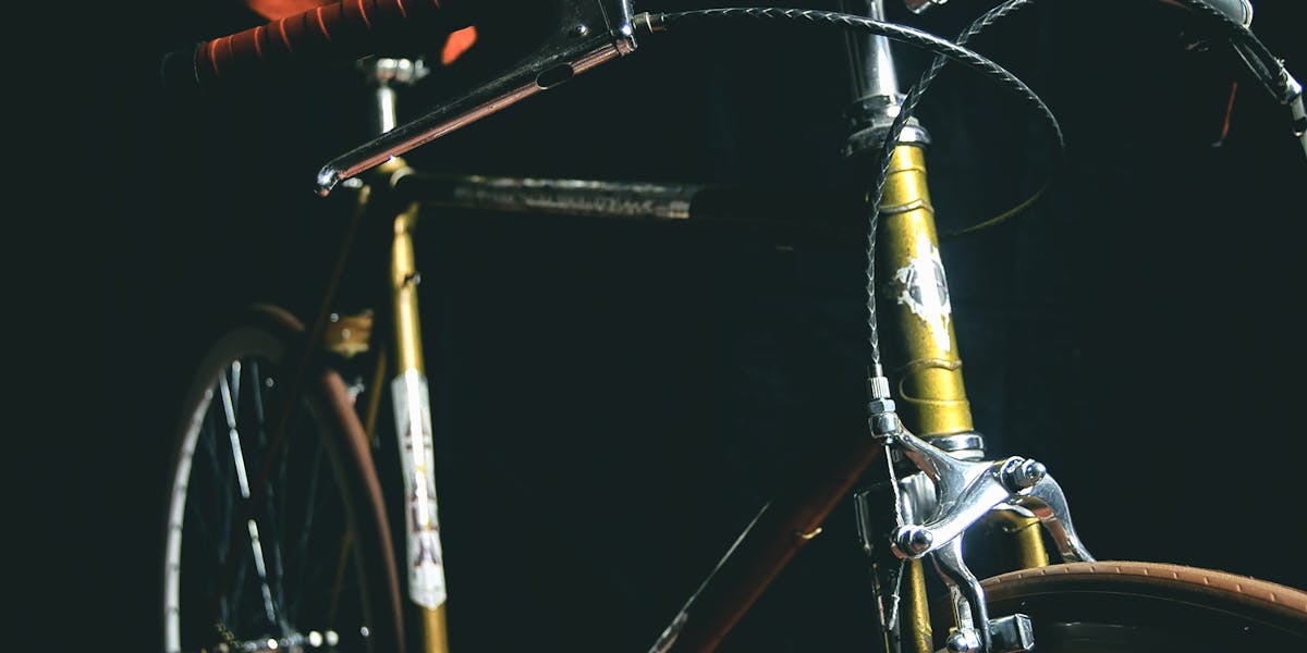 Close-up of a mountain bike on a forest trail, capturing outdoor adventure themes.