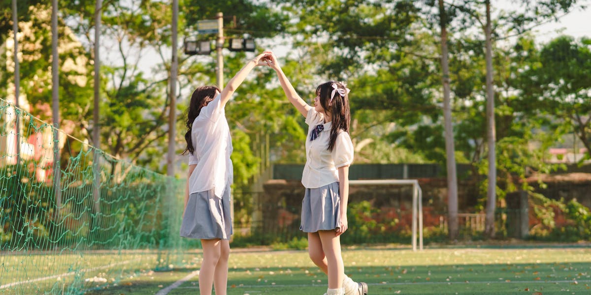 Close-up of billiard chalk, cue stick, and ball on a pool table.
