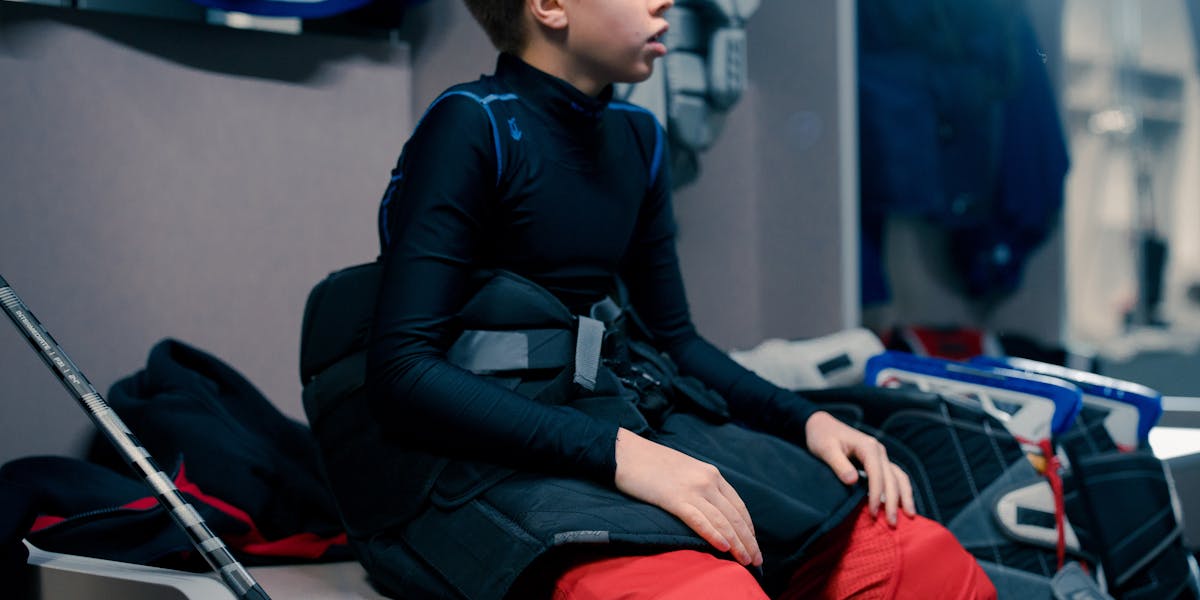 A close-up of a fun sign highlighting dad's fishing rules placed by a river, perfe...