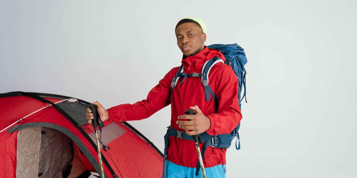 From above of drip coffee maker near package and portable gas bottle with burner