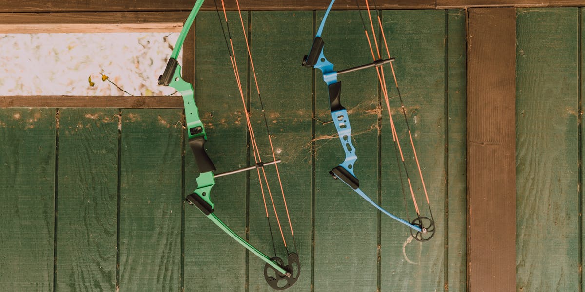 Close-up view of a person wearing medals on a shoulder strap, outdoors.