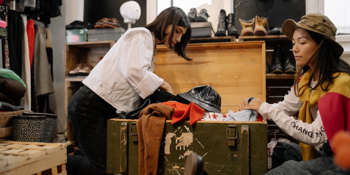 Man in camouflage holding a rifle in a snowy field, showcasing hunting attire an