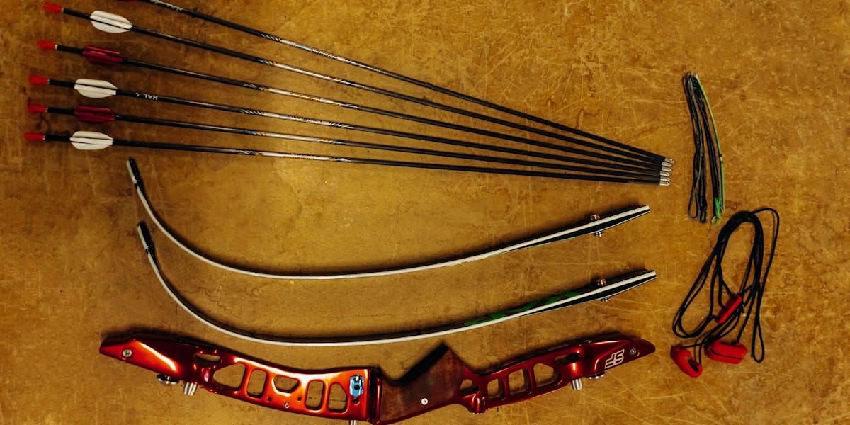 Close-up of a well-used archery target with numerous bullet holes in an outdoor 