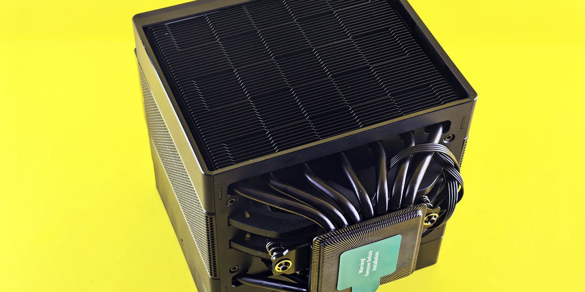 Two men hiking up rocky trail carrying picnic supplies for an outdoor adventure.