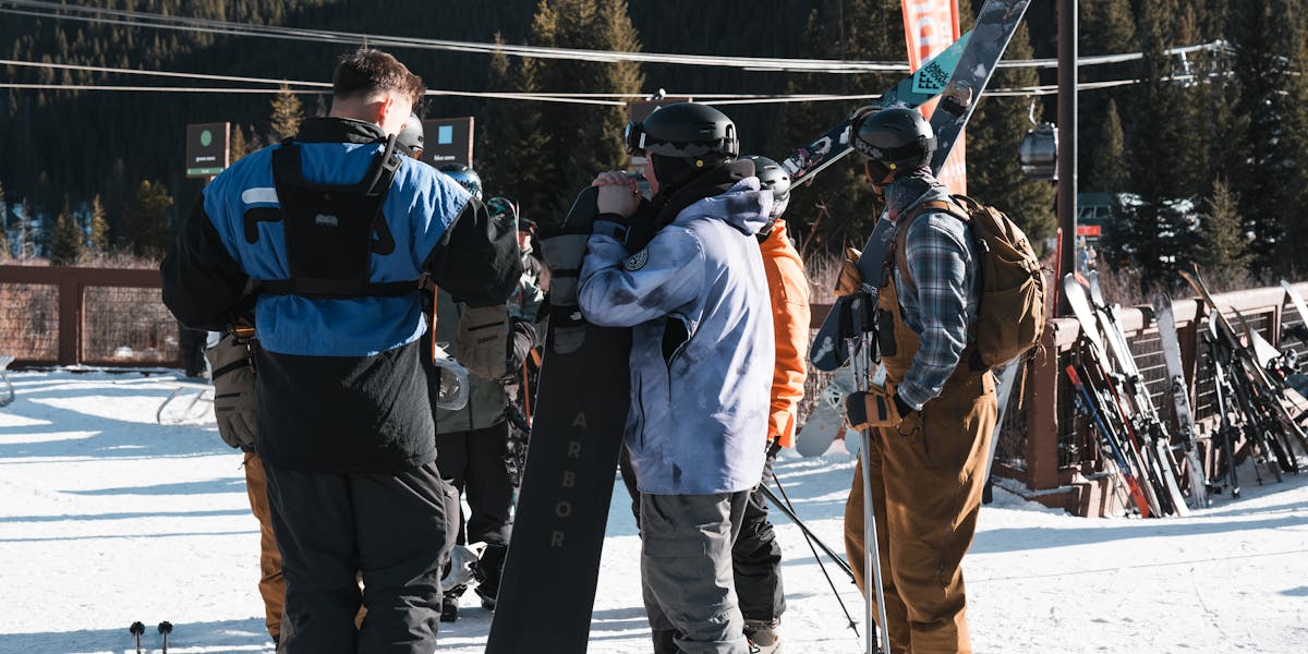 Vibrant close-up of a snowboarder wearing goggles, capturing the thrill of winter ...