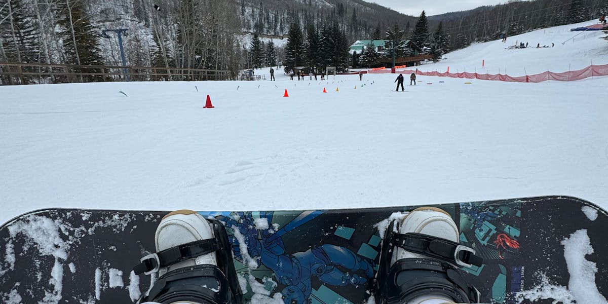 Experience a winter adventure through the eyes of a snowboarder on a snowy mount