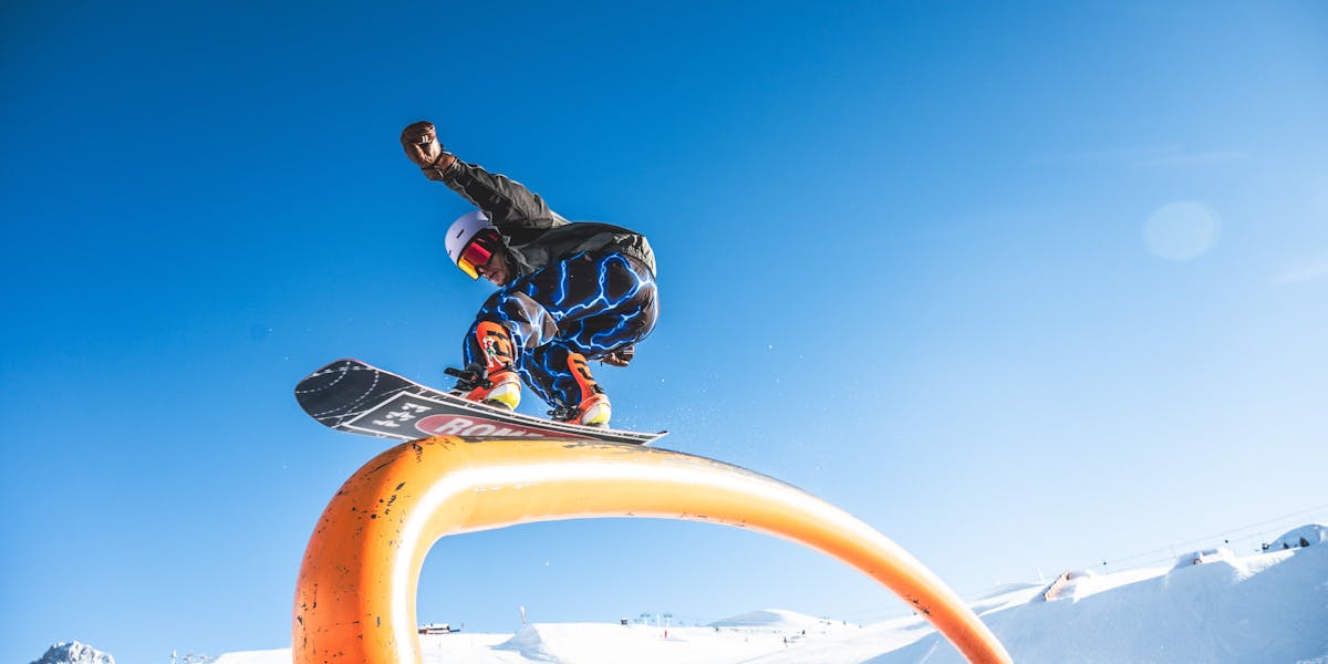 Winter sports enthusiasts gather at a snowy mountain resort, ready for skiing and ...