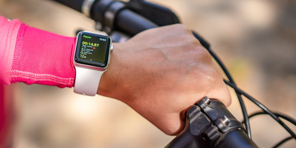 Two women using a mobile app for bike sharing in an urban park in Mexico City.